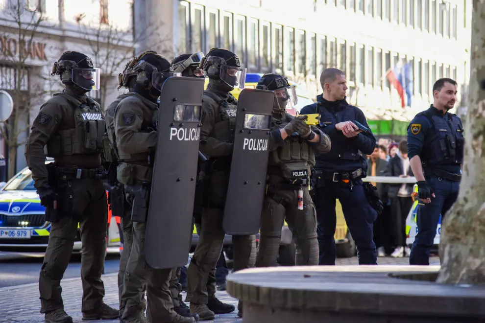 Special task police deployed to subdue a man threatening people with two knives. Photo: Luka Tetičkovič/STA