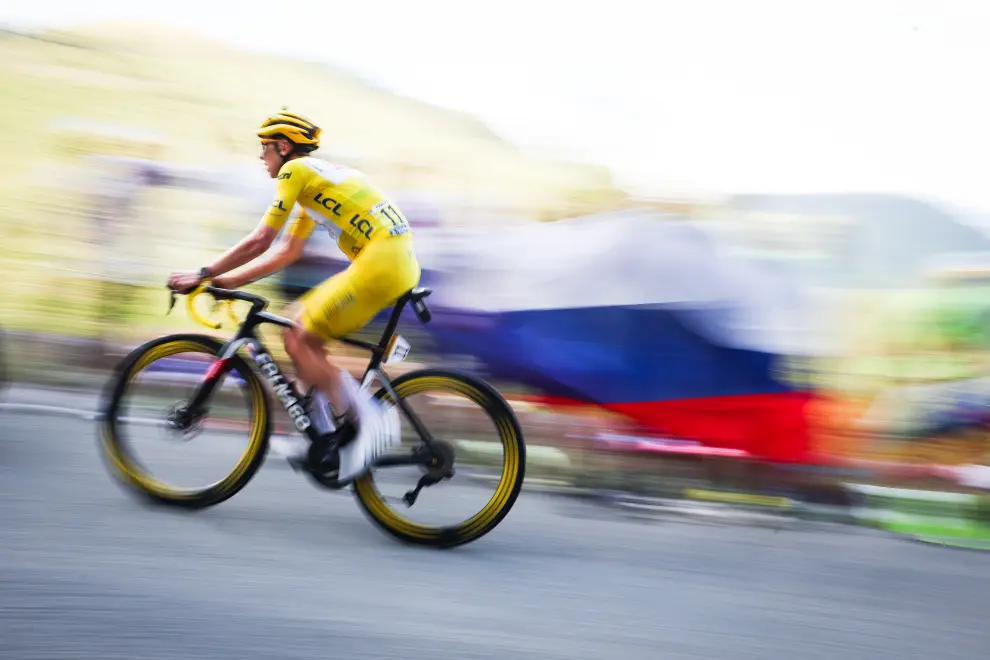 Tadej Pogačar rides past Slovenian fans in stage 20 of the 2024 Tour de France. Photo: Anže Malovrh/STA