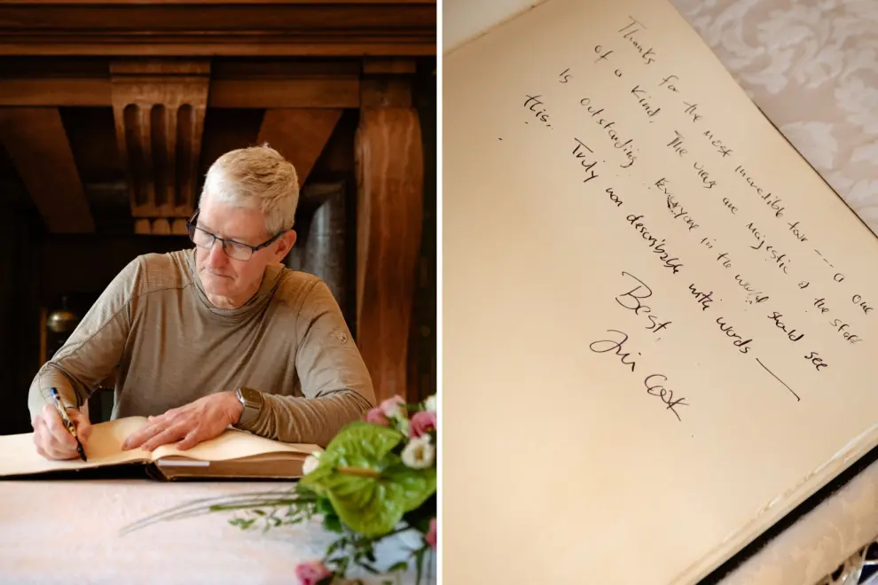 Apple CEO Tim Cook writes into the Postojna Cave visitors' book. Photo: Postojna Cave operator