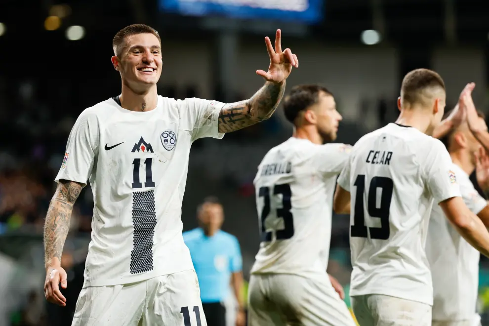 Slovenia forward Benjamin Šeško (left) scores a hat-trick for a UEFA Nations League win against Kazakhstan. Photo: Anže Malovrh/STA