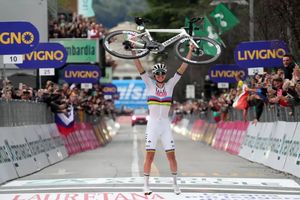 Tadej Pogačar celebrates his record-equalling fourth-straight Lombardia win. Photo: dpa/STA