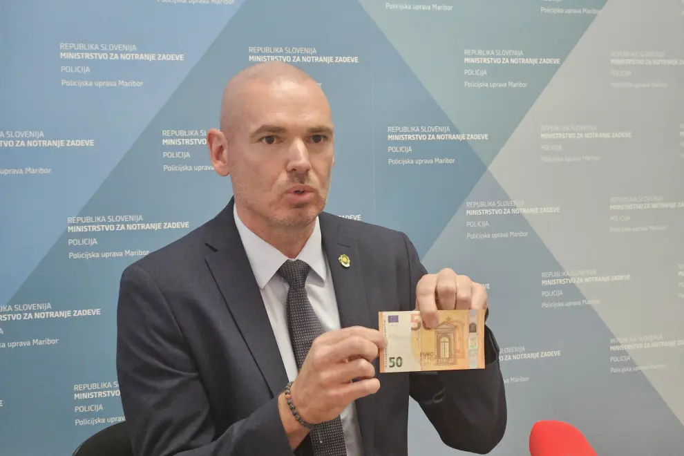 Stanko Vidovič, the chief of Maribor criminal investigators, holds a fake €50 banknote as he presents a money counterfeiting investigation. Photo: Gregor Mlakar/STA