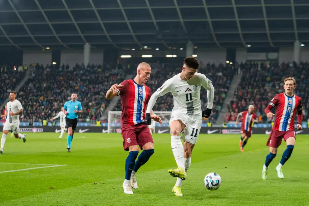 Benjamin Šeško (white) scored the sole goal for Slovenia for a 1:4 loss to Norway at home. Photo: Boštjan Podlogar/STA