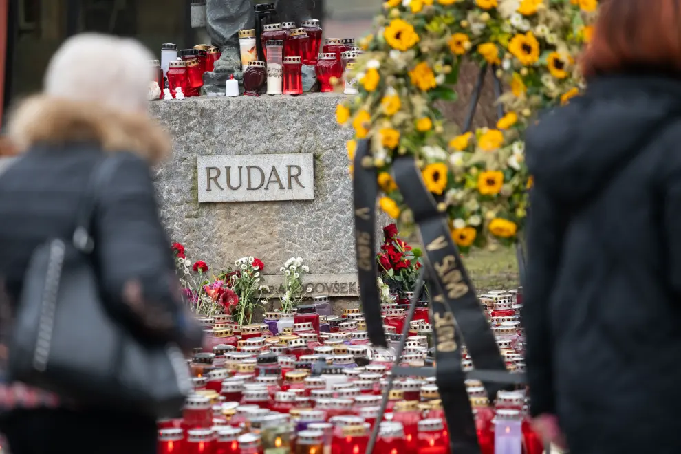 People leave hundreds of candles at a monument to a miner in the centre of Velenje as Slovenia observes a national day of mourning for three miners killed in a 20 January accident. Photo: Boštjan Podlogar/STA