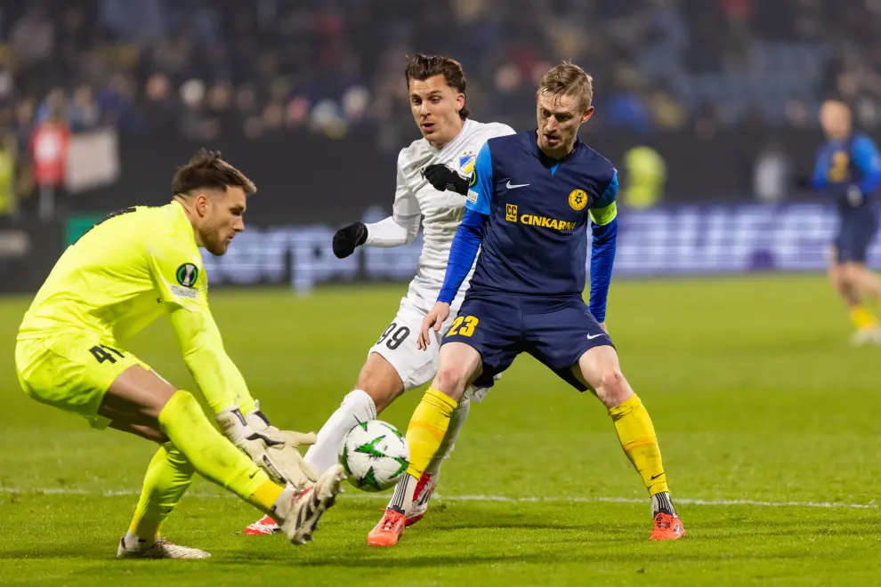 Celje goalie Ricardo Silva (yellow) and defender Žan Karničnik (blue) in the first leg of the UEFA Conference League knockout phase play-offs vs APOEL Nicosia. Photo: Boštjan Podlogar/STA