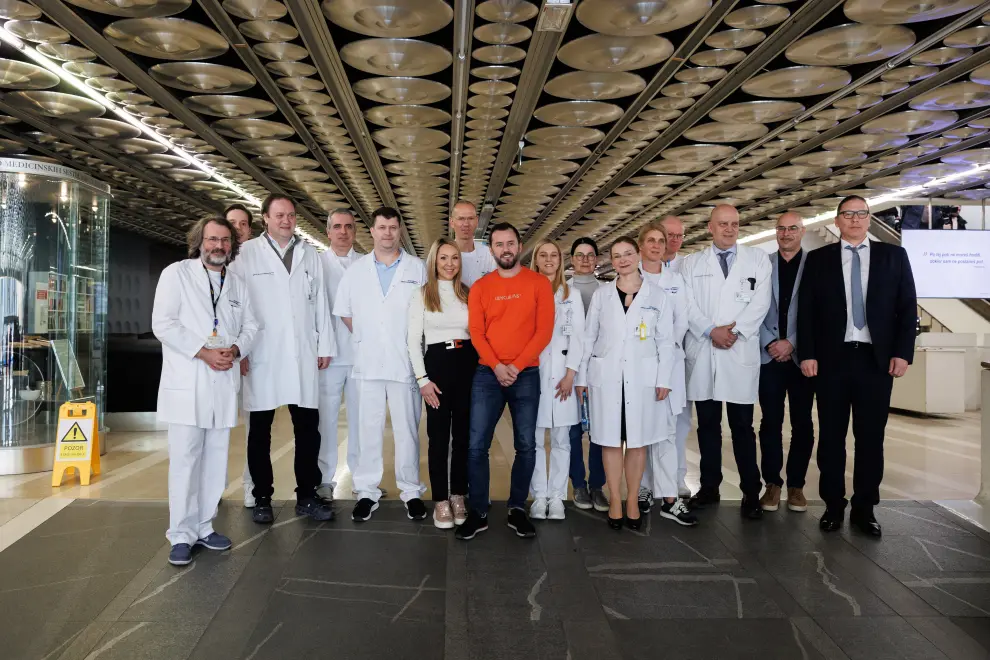 The UKC Ljubljana team pictured with the parents of the baby who underwent heart transplant. Photo: Nebojša Tejić/STA