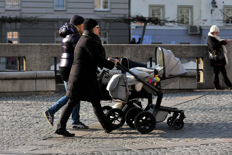 Mums walk with children in prams. Photo: Tamino Petelinšek/STA