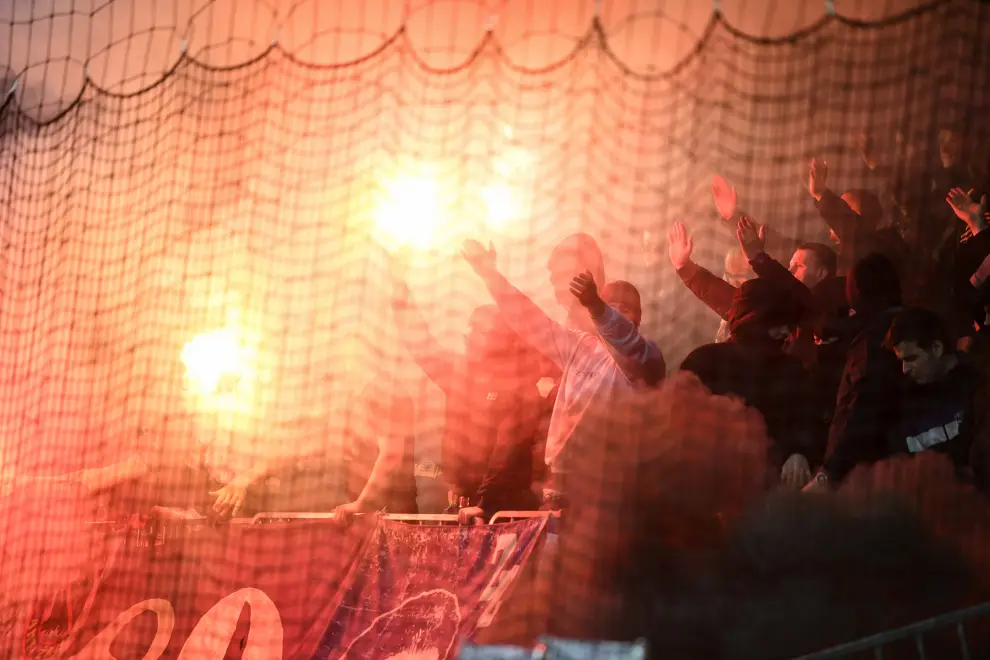 Football fans amid flares at a match. Photo: Nebojša Tejić/STA