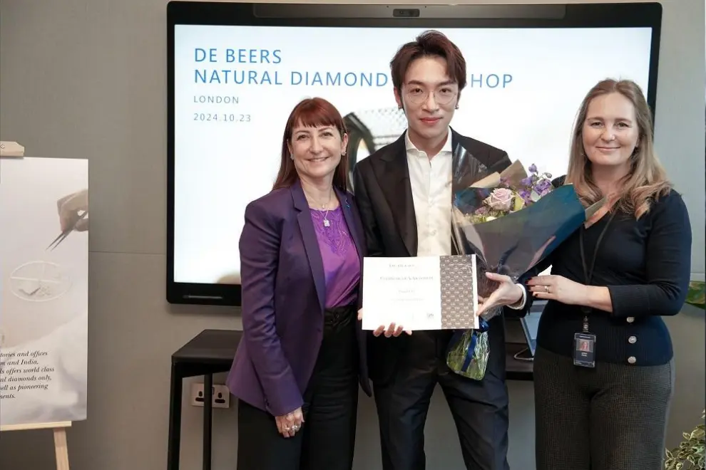 From left to right - Experts from De Beers Institute of Diamonds instructing media to use appraisal techniques; Sandrine Conseiller (far left), CEO of De Beers brands and Jodine Bolden, Director of Education of De Beers Institute of Diamonds (far right) presenting natural diamond workshop certificate to media; Influencers admiring rough coloured natural diamonds.