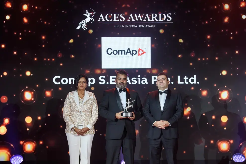 ComAp S.E. Asia Pte. Ltd. Managing Director, Bhuneshwar Prasad (centre), proudly accepts the prestigious ACES Awards trophy on stage from Dr. Shanggari Balakrishnan, President of the ACES Awards (left), and Mr. Luis Bueno Nieto, Advisor to the ACES Council (right).