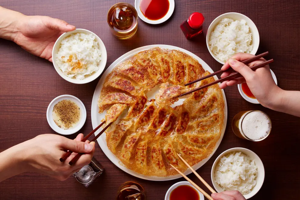 *Fried Gyoza with the perfect HANE paired with beer, sauce, and rice in a traditional Japanese meal.