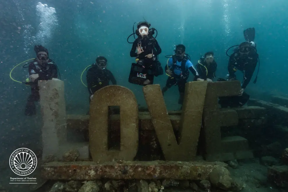 Tourism Secretary Christina Garcia Frasco joins delegates of the Department of Tourism's inaugural Philippine Dive Experience at LOVE Reef-an artificial structure designed to support coral growth, provide habitat and breeding grounds for marine species, and enhance shoreline protection. Photo by the Philippine Department of Tourism.