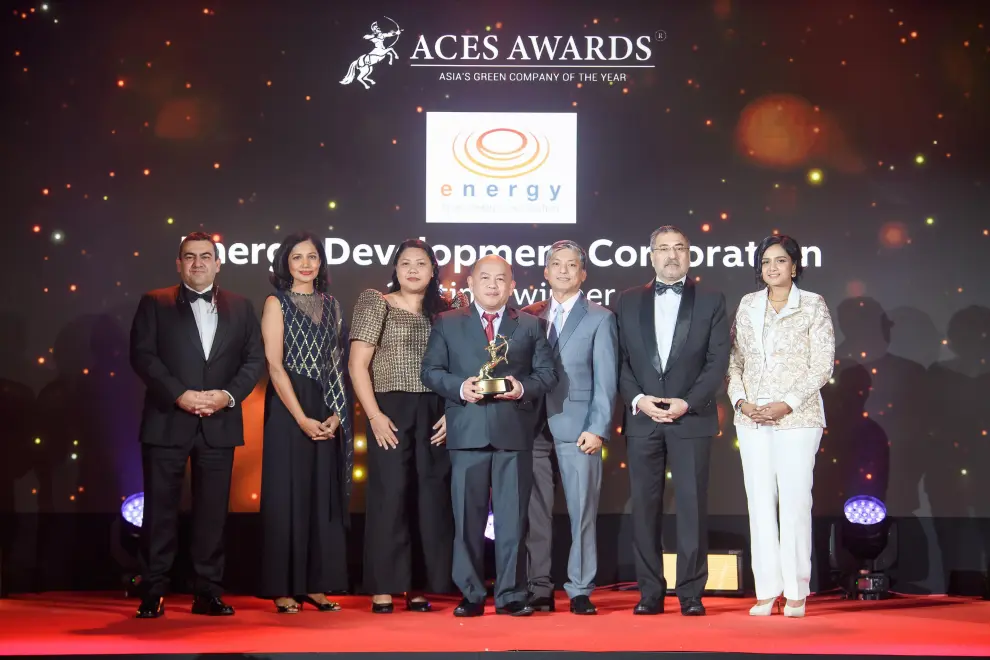 Energy Development Corporation was proudly honoured as Asia's Green Company of the Year at the ACES Awards 2024. Representing EDC on stage were Abegail Gatdula, Watershed Management Officer (left center), Erwin Magallanes, Head of Corporate Relations (center), and Danilo Tolarba, AVP & Human Resource Head (right center). The award was presented by Luis Bueno Nieto, Advisor, ACES Council (left), Dr Jayanthi Desan, Advisor, ACES Council (2nd from left), Dr Shanggari Balakrishnan, President, ACES Awards (right), and Hemant Batra, Honorary Chairman, ACES Council (2nd from right). This recognition cements EDC's leadership in sustainability and green innovation across Asia.