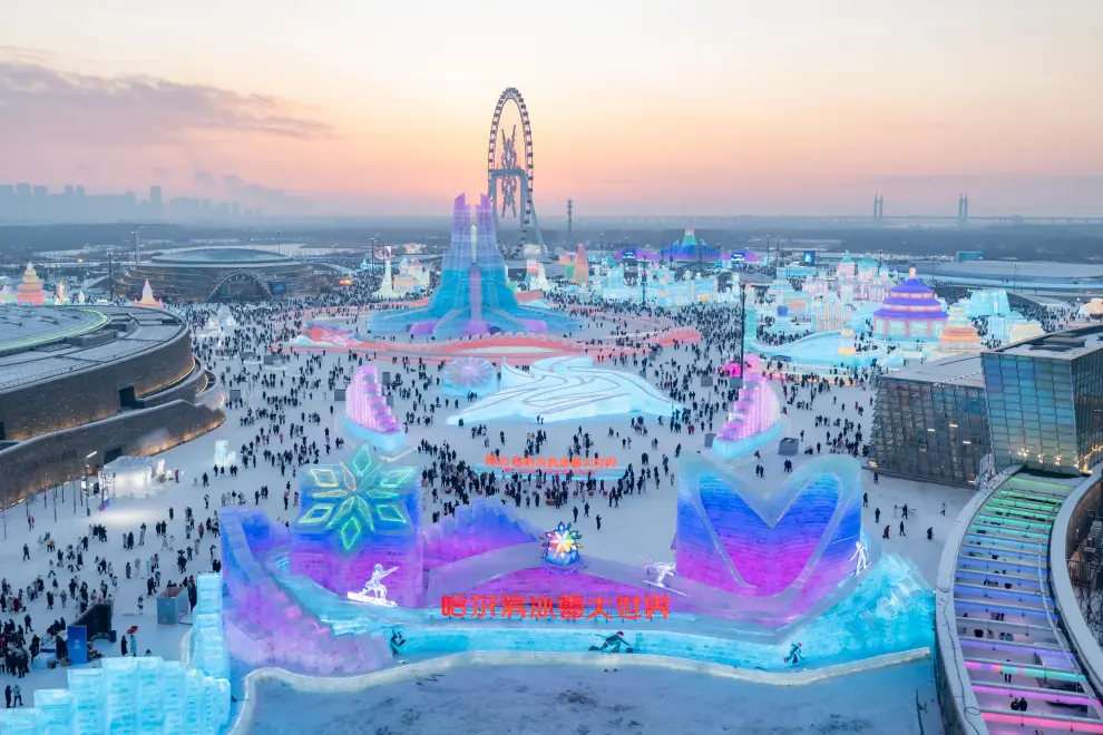 An aerial drone photo shows a view of the Harbin Ice-Snow World in Harbin, northeast China's Heilongjiang Province, Dec. 21, 2024. (Xinhua/Xie Jianfei)