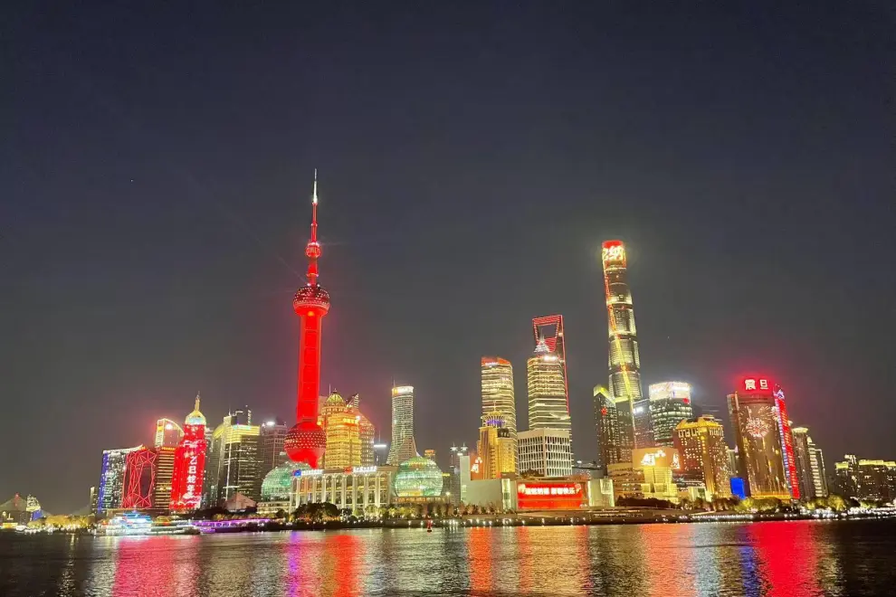 View of the Lujiazui skyline as Shanghai Oriental Pearl Tower lights up in red in the evening on January 28, 2025.