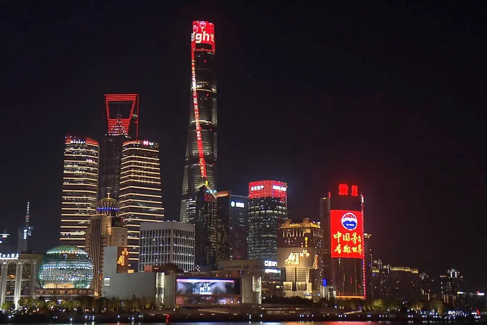 Shanghai Tower lights up in red in the evening on January 28, 2025.