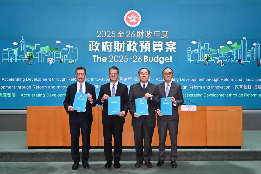 Hong Kong SAR's Financial Secretary, Paul Chan (second left), at a press conference on the 2025-26 Budget