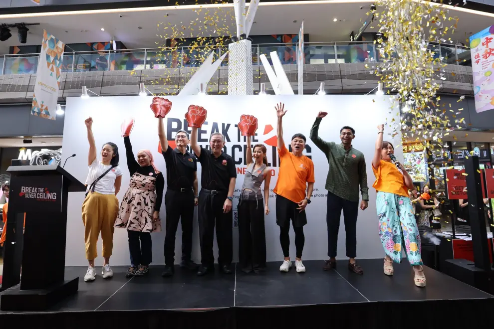 The "Break the Silver Ceiling: One Photo at a Time" Exhibition was launched by AIC Chairman Dr Gerard Ee, fourth from left, at Our Tampines Hub on 1 October 2024. He was joined by (from left to right) Ms Mindy Tan, Ms Amiera Raushan, Mr Noel Cheah, Ms Hanan Al-Johary, Mr Jack Neo, Mr Ian Jeevan, and Ms Lim Peifen.